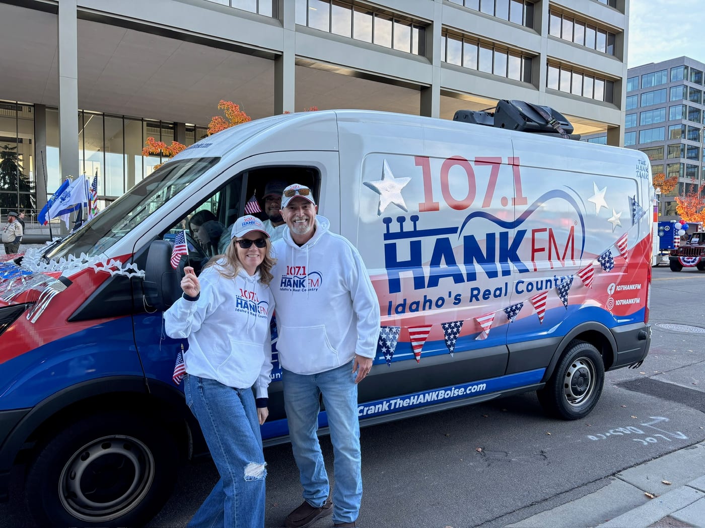 107.1 Hank FM branded van at a Boise parade
